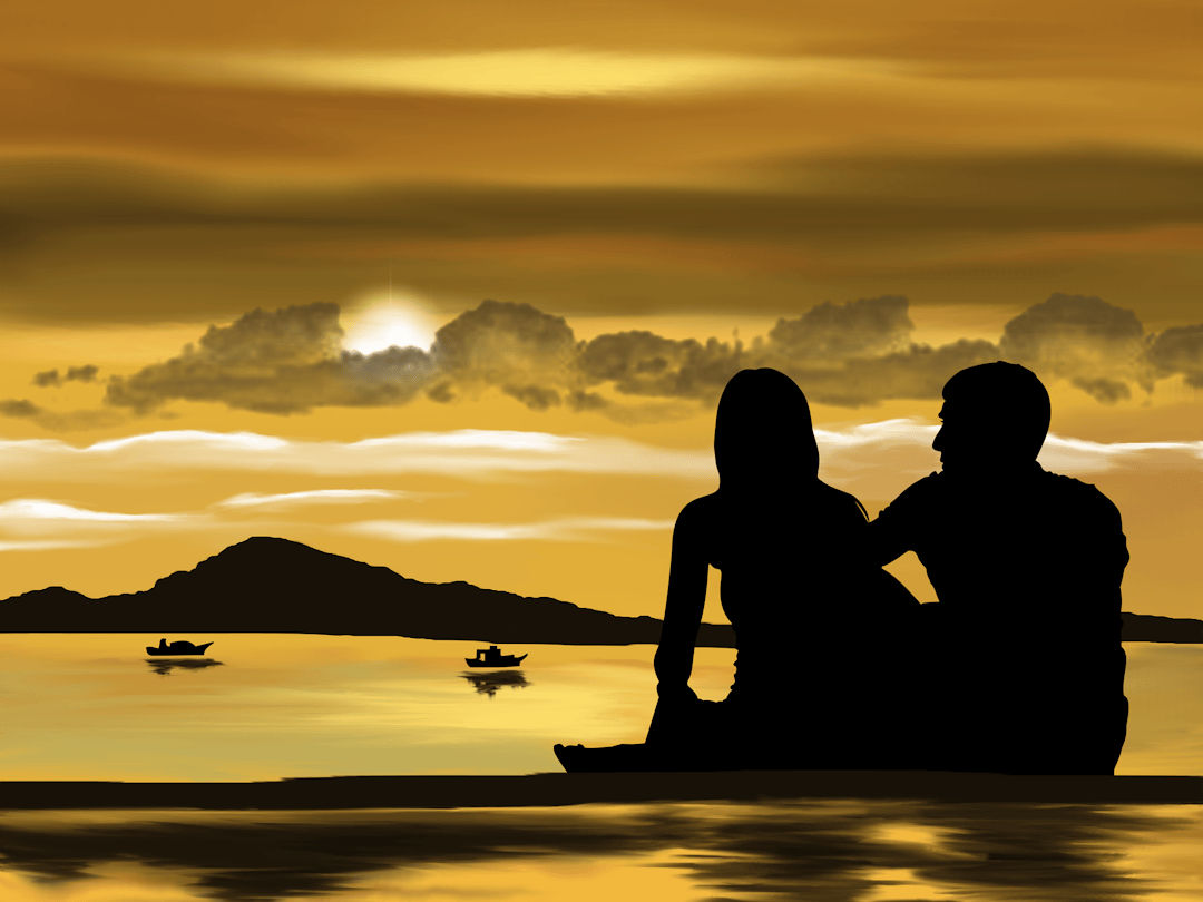 silhouette of 2 person sitting on boat during sunset